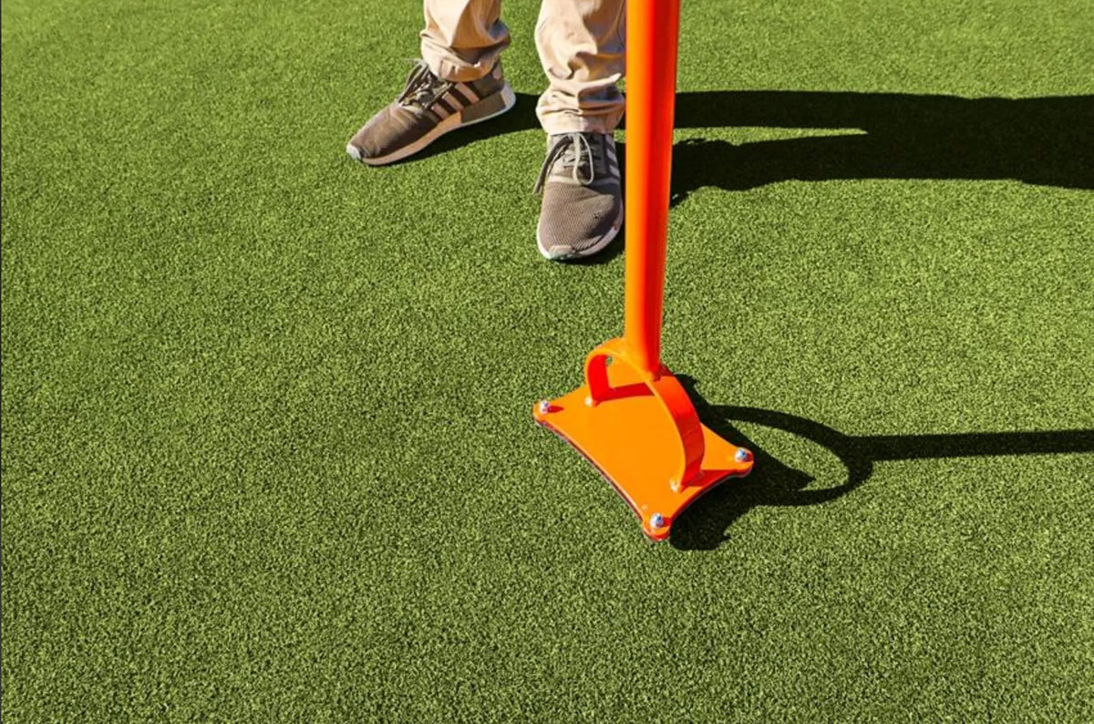 Top of the Accuform Fixed Spiker plate and handle on a green