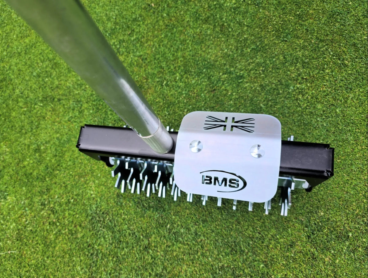Top view of the BMS Rotary Hand Seed Slotter on a golf green