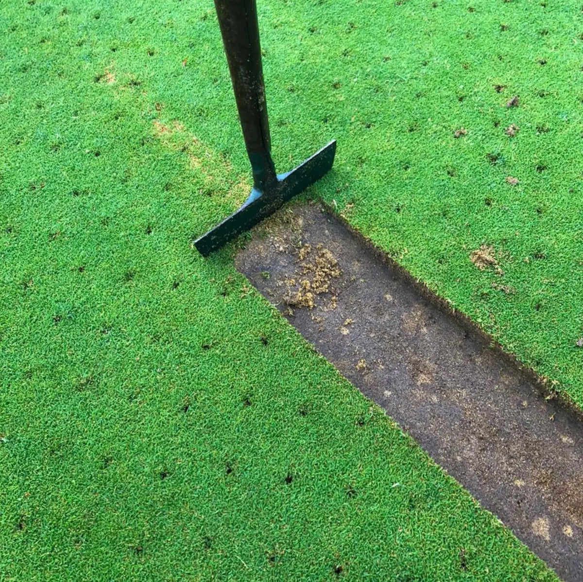 BMS Turf Slitter used to cut a turf strip on a golf green