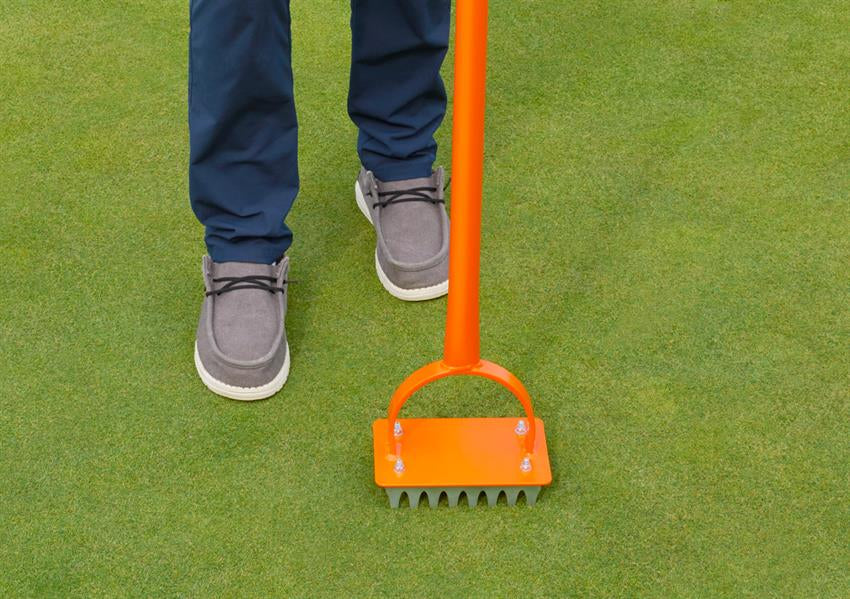 Accuform Slot Seeder in use on a golf green
