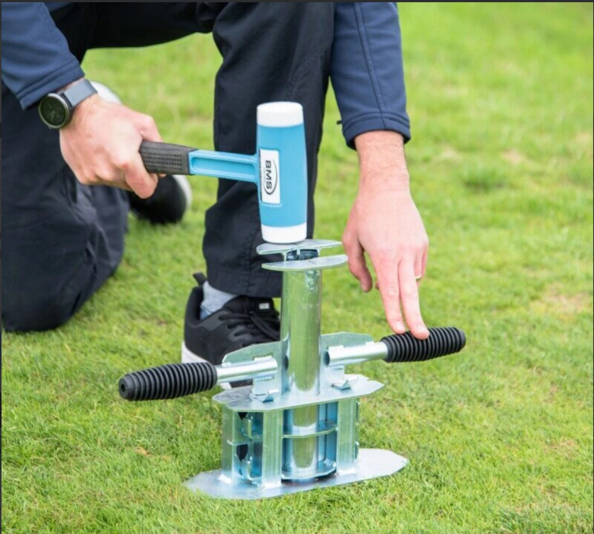 BMS Impact Soil Sampler being driven into turf with a mallet