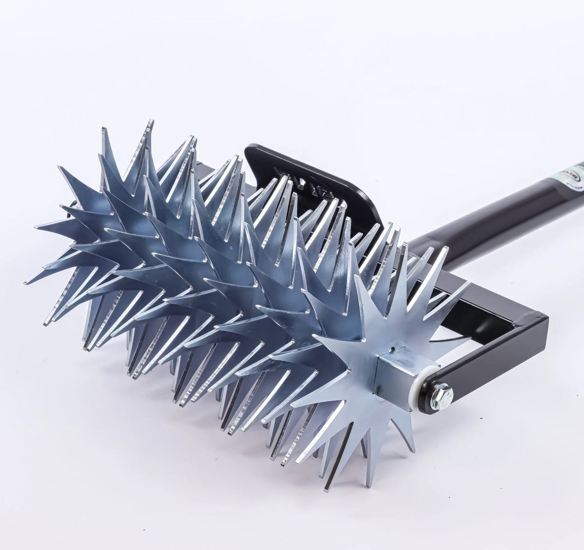 Close up of the spiked drum on the BMS Rotary Hand Lawn Spiker