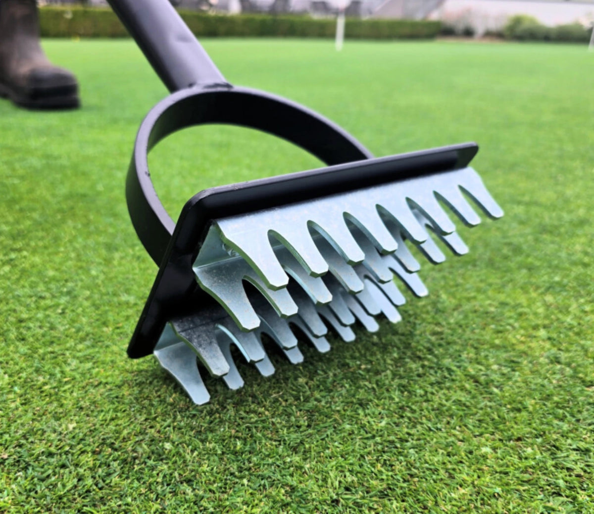 BMS Static Seed Slotter resting on turf ready to slot seed into a worn area